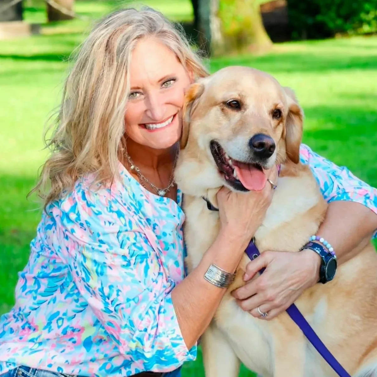 Sgt. Laura Grantham hugging ESD K9 Estie